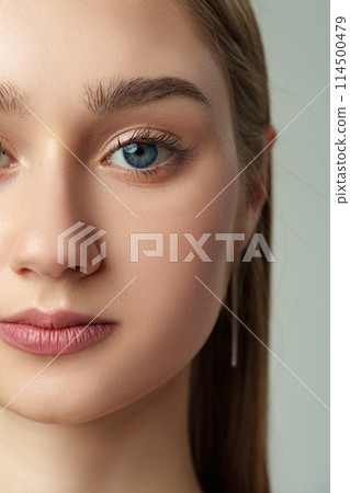 Close Up of Womans Face With Blue Eyes Close Up of Womans Face With Blue Eyes 114500479