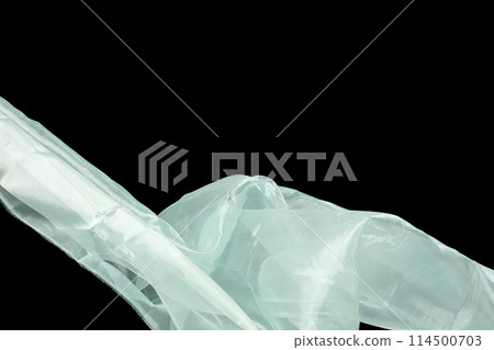 Off White Organza fabric flying in curve shape, Piece of textile White Organza fabric throw fall in air. Black background isolated motion blur Off White Organza fabric flying in curve shape, Piece of textile White Organza fabric throw fall in air. Black background isolated motion blur 114500703