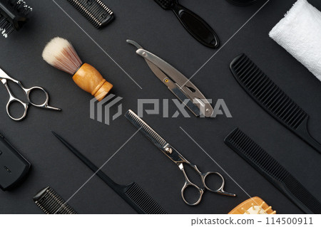 Variety of Hair Styling Tools and Accessories Displayed on a Dark Background Variety of Hair Styling Tools and Accessories Displayed on a Dark Background 114500911