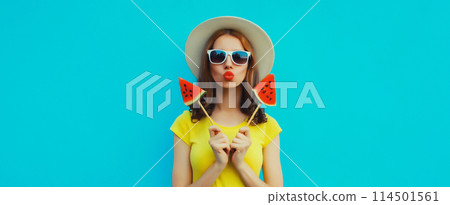 Summer portrait of stylish young woman with juicy lollipop or ice cream shaped slice of watermelon 114501561