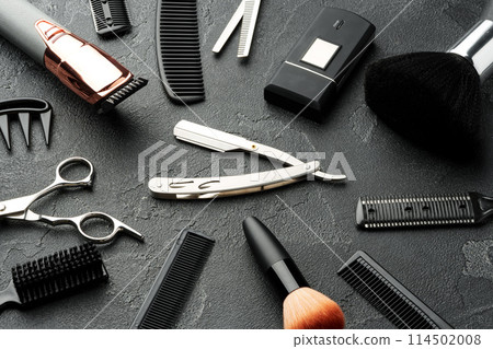 Set of tools for hairdressing and barbershop on gray background Set of tools for hairdressing and barbershop on gray background 114502008
