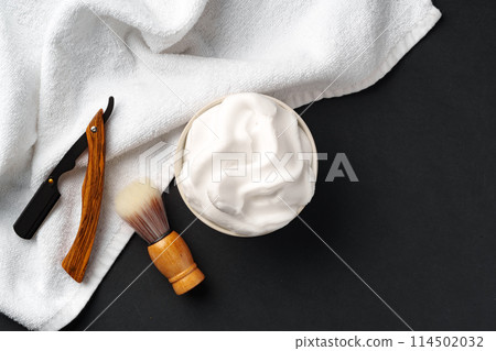 Traditional Wet Shaving Gear Arranged on a Dark Background With Morning Light 114502032
