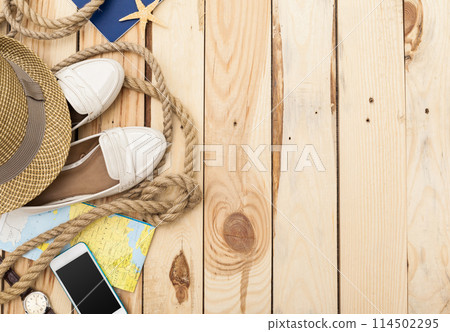 Accessories for travel. Passport, photo camera and travel map. Top view. Holidays and tourism concept Accessories for travel. Passport, photo camera and travel map. Top view. Holidays and tourism concept 114502295