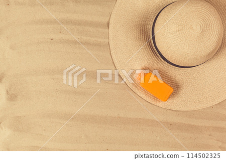 Summer hat put on the tropical sand beach Summer hat put on the tropical sand beach 114502325