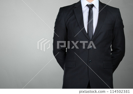 A businessman with his arms crossed A businessman with his arms crossed 114502381