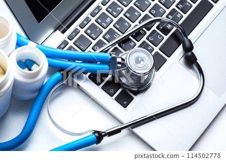 Medical stethoscope on computer keyboard Medical stethoscope on computer keyboard 114502778