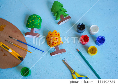 Kids craft trees out of recycling toilet paper roll, zero waste concept. Kids craft trees out of recycling toilet paper roll, zero waste concept. 114502785