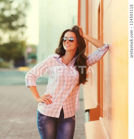 Portrait beautiful happy smiling brunette young woman posing in the city 114503118