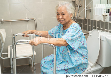 Asian elderly woman patient use toilet bathroom handle security in nursing hospital, healthy strong medical concept. Asian elderly woman patient use toilet bathroom handle security in nursing hospital, healthy strong medical concept. 114503243