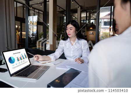 Business meeting to analyze and discuss the situation on the financial report in the meeting room. Investment Consultant, Financial advisor and accounting concept 114503410