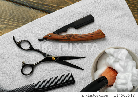 Hairdressing barber tools on wooden background close up 114503518