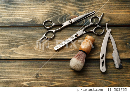 Set of professional barber tools on wooden table 114503765