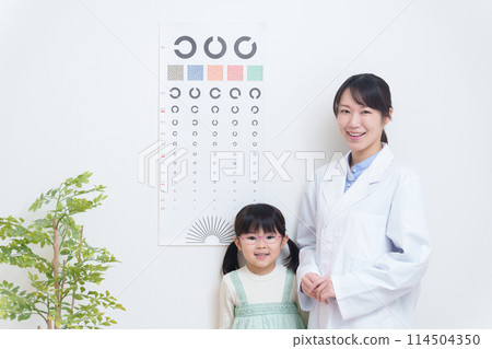 Amblyopic child undergoing vision test at eye clinic 114504350