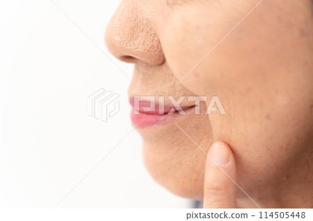 Senior woman nasolabial folds Senior woman nasolabial folds 114505448