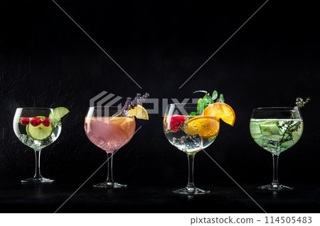 Fancy cocktails with fresh fruit. Gin and tonic drinks with ice at a party 114505483