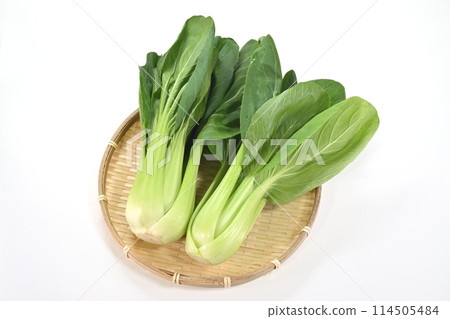 Bok choy placed on a bamboo colander 114505484