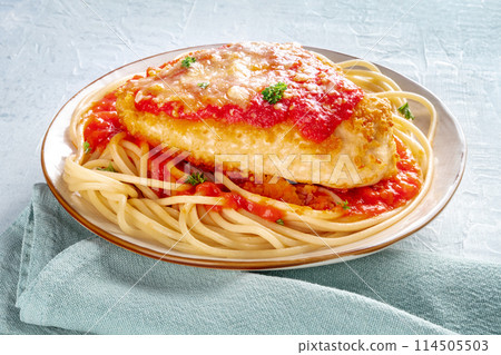 Chicken Parmesan, Italian pasta dish. Breaded chicken breast with cheese 114505503