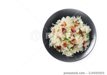 Slovak potato dumplings halusky with steamed sauerkraut and bacon isolated on white background 114505855