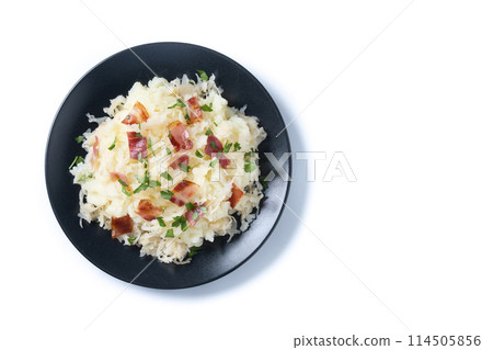Slovak potato dumplings halusky with steamed sauerkraut and bacon isolated on white background Slovak potato dumplings halusky with steamed sauerkraut and bacon isolated on white background 114505856