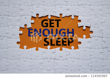 Get enough sleep symbol. White puzzle with words Get enough sleep. Beautiful orange background. Healthy lifestyle, medical and Get enough sleep concept. Copy space. 114505997