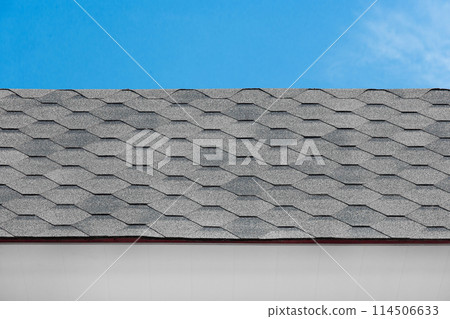 Grey mosaic tile roof house structure abstract building home pattern design object blue sky background Grey mosaic tile roof house structure abstract building home pattern design object blue sky background 114506633