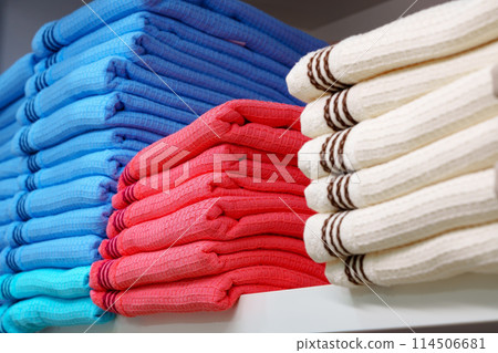 Stack of Neatly Folded White Towels on a Retail Store Shelf Stack of Neatly Folded White Towels on a Retail Store Shelf 114506681
