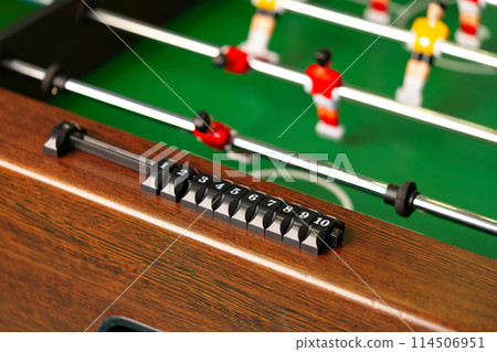 Close Up of a Foosball Table With Foosball Players 114506951