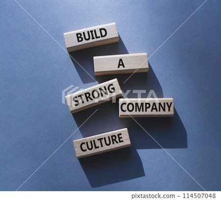 Company culture symbol. Wooden blocks with words Build a strong company culture. Beautiful grey background. Business and Company culture concept. Copy space. Company culture symbol. Wooden blocks with words Build a strong company culture. Beautiful grey background. Business and Company culture concept. Copy space. 114507048