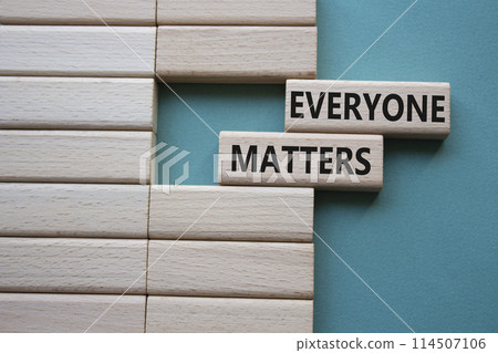 Everyone matters symbol. Concept words Everyone matters on wooden blocks. Beautiful grey green background. Business and Everyone matters concept. Copy space. 114507106