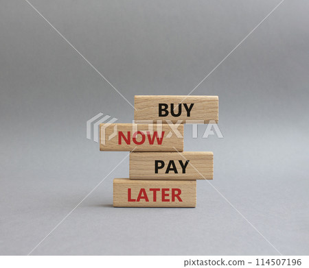 Buy now Pay later symbol. Concept word Buy now Pay later on wooden block. Beautiful grey background. Business and Buy now Pay later concept. Copy space 114507196