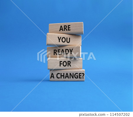 Change symbol. Wooden blocks with words Are you ready for a new change. Beautiful blue background. Business and change concept. Copy space. Change symbol. Wooden blocks with words Are you ready for a new change. Beautiful blue background. Business and change concept. Copy space. 114507202