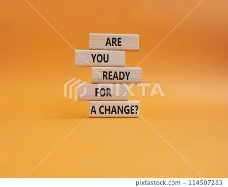 Change symbol. Wooden blocks with words Are you ready for a new change. Beautiful orange background. Business and change concept. Copy space. Change symbol. Wooden blocks with words Are you ready for a new change. Beautiful orange background. Business and change concept. Copy space. 114507283