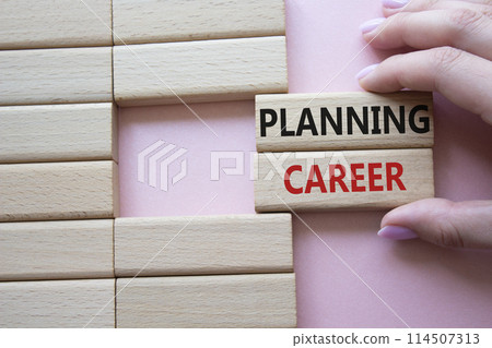 Planning Career symbol. Wooden blocks with words Planning Career. Beautiful pink background. Businessman hand. Business and Planning Career concept. Copy space. Planning Career symbol. Wooden blocks with words Planning Career. Beautiful pink background. Businessman hand. Business and Planning Career concept. Copy space. 114507313