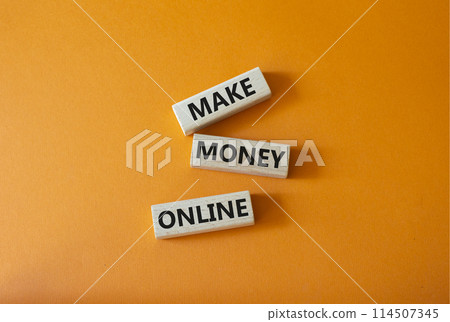 Make Money Online symbol. Concept words Make Money Online on wooden blocks. Beautiful orange background. Business and Make Money Online concept. Copy space. 114507345