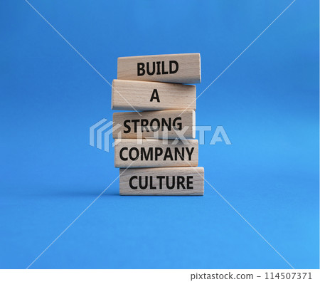 Company culture symbol. Wooden blocks with words Build a strong company culture. Beautiful blue background. Business and Company culture concept. Copy space. Company culture symbol. Wooden blocks with words Build a strong company culture. Beautiful blue background. Business and Company culture concept. Copy space. 114507371