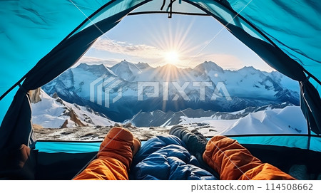 A couple enjoying the view of snowcapped mountains from their te 114508662