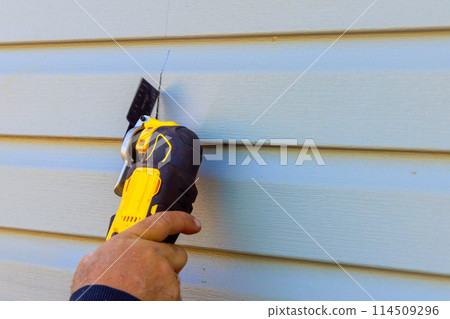 Replacement of exterior plastic siding on wall of house 114509296