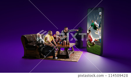 Tense game moment. Men sitting at home with snacks and beer, emotionally watching online football match translations on 3d model of screen 114509428