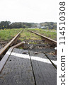 A rural scene in Japan, a single railroad track stretching straight ahead on a local line, from a low-rider's perspective 114510308