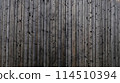 Gray wood texture background. The wood panel has a beautiful dark pattern. 114510394