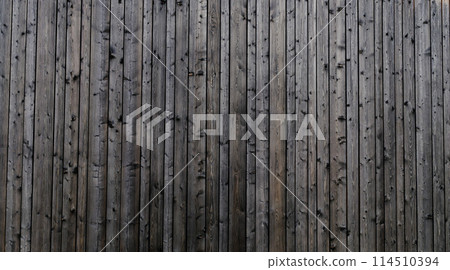 Gray wood texture background. The wood panel has a beautiful dark pattern. 114510394