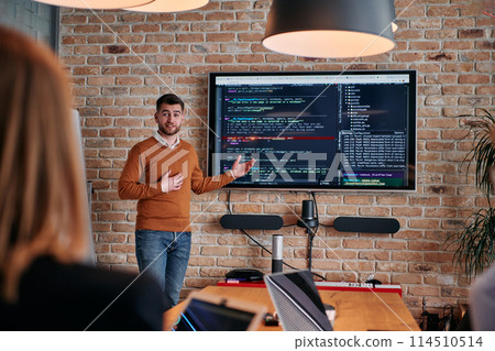 In a corporate setting businessman leads a meeting, passionately presenting a business plan to his attentive team, fostering collaboration and strategic thinking 114510514