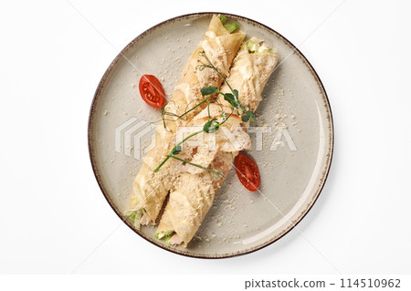 Gourmet stuffed crepe rolls with Caesar dressing and parmesan Gourmet stuffed crepe rolls with Caesar dressing and parmesan 114510962