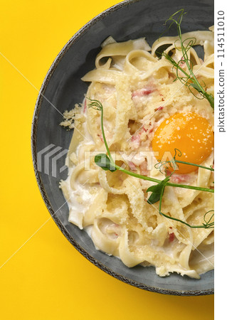 Classic pasta carbonara with pancetta, egg yolk and parmesan 114511010