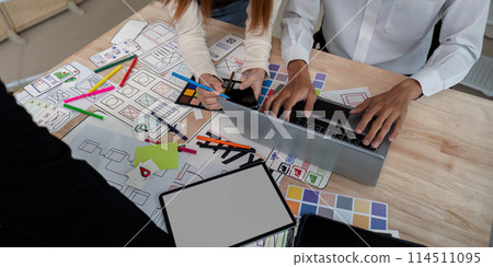 Brainstorm team of creative web graphic designer planning, Group of mobile phone app developer team meeting for share ideas about screen prototype layout for smartphone. startup planning ui and ux 114511095