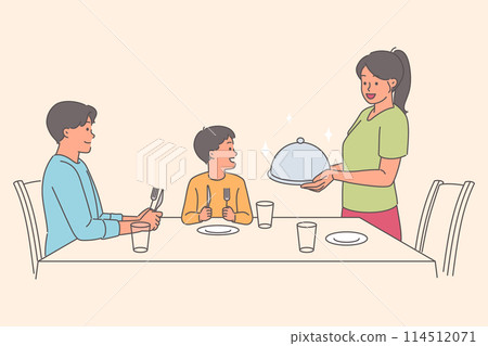 Caring woman serves dinner to husband and son sitting at table, during family holiday Caring woman serves dinner to husband and son sitting at table, during family holiday 114512071