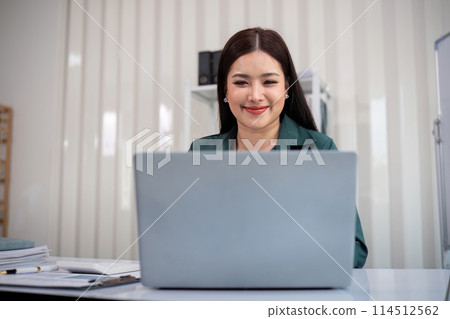 Business accounting woman counting on calculator working on financial document in hands closeup. Bookkeeping concept 114512562