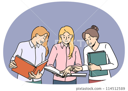 Smiling female colleagues discuss paperwork together 114512589