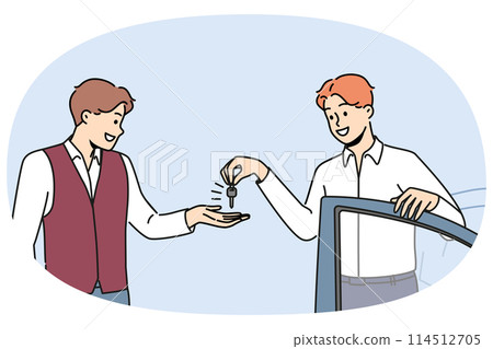 Smiling businessman give car key to parking staff 114512705