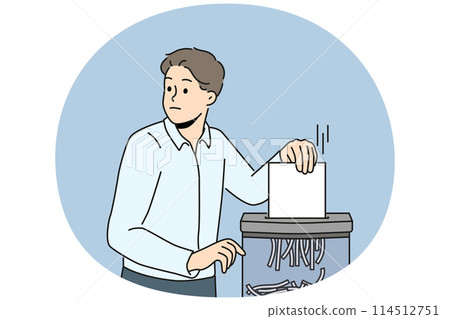 Businessman put document in shredder Businessman put document in shredder 114512751
